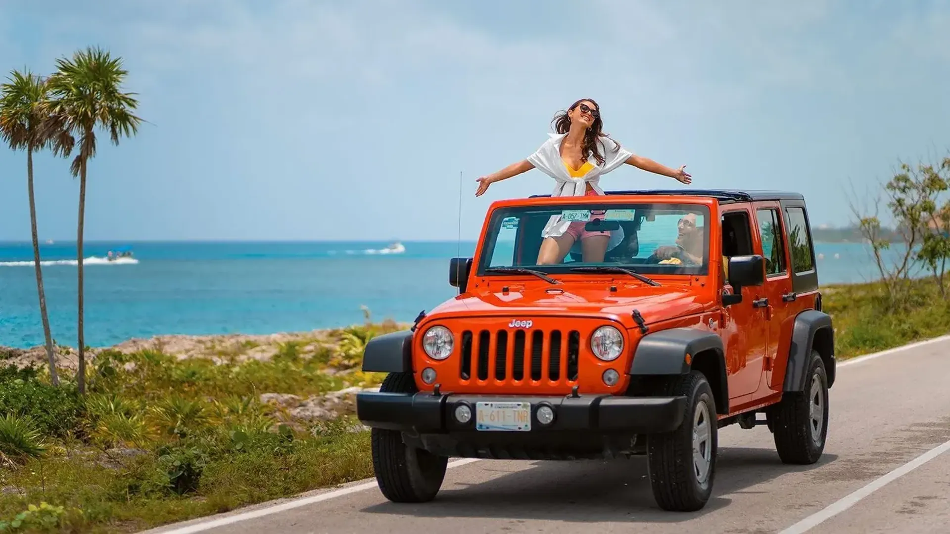 Orange Jeep on the coastal road of Cozumel’s east side