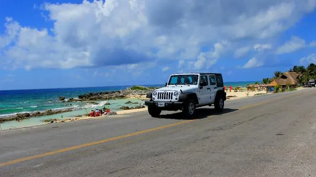 White Jeep on the east-coast road by the sea