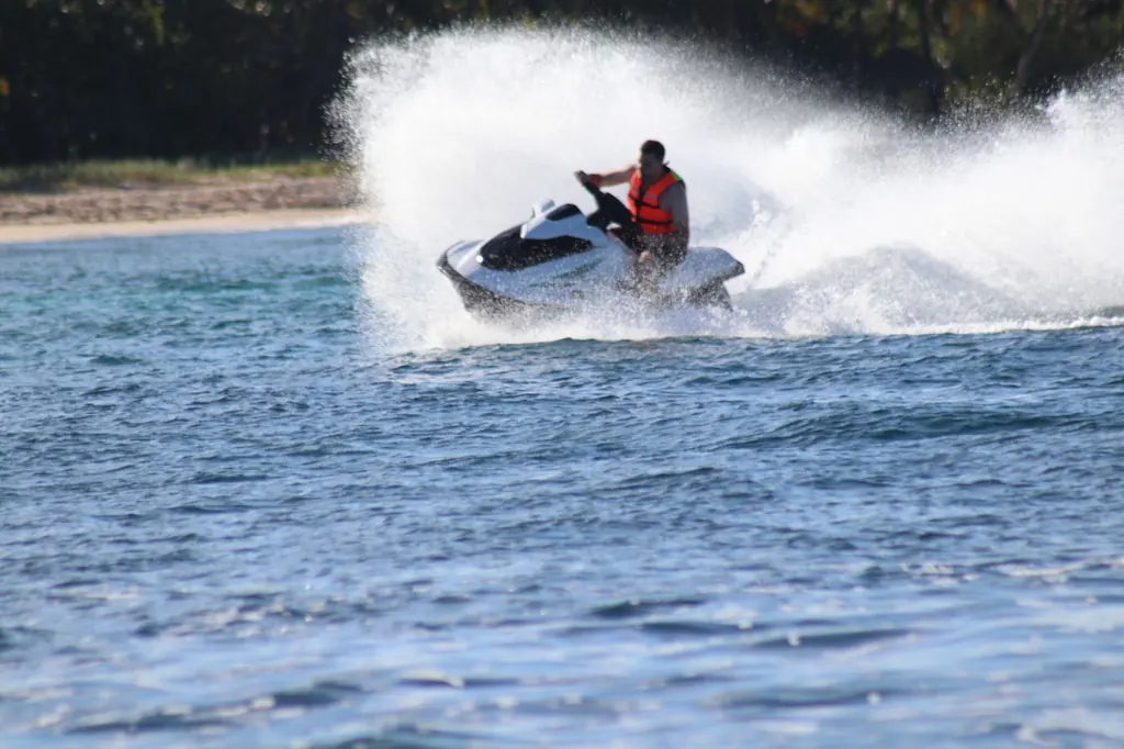 Jet ski spraying water on the Caribbean